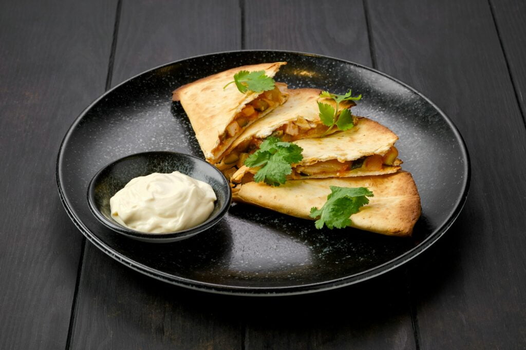 Quesadilla with chicken meat, cheese and pickled cucumber