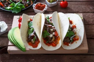 Fajitas, mexican beef with grilled vegetable in tortilla wraps