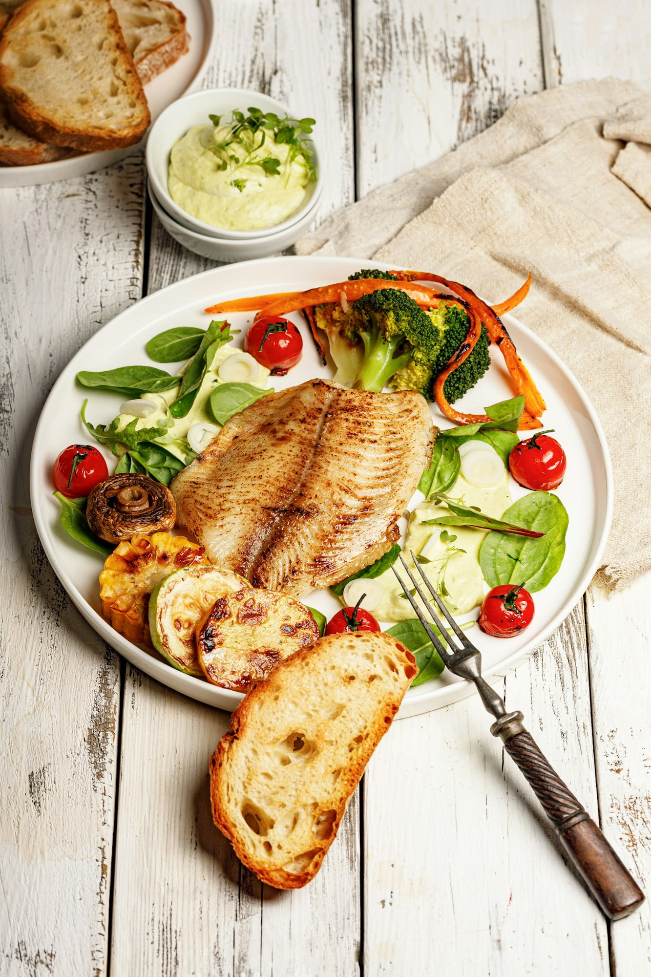 Fried sea fish and vegetables. Tilapia fillet with broccoli