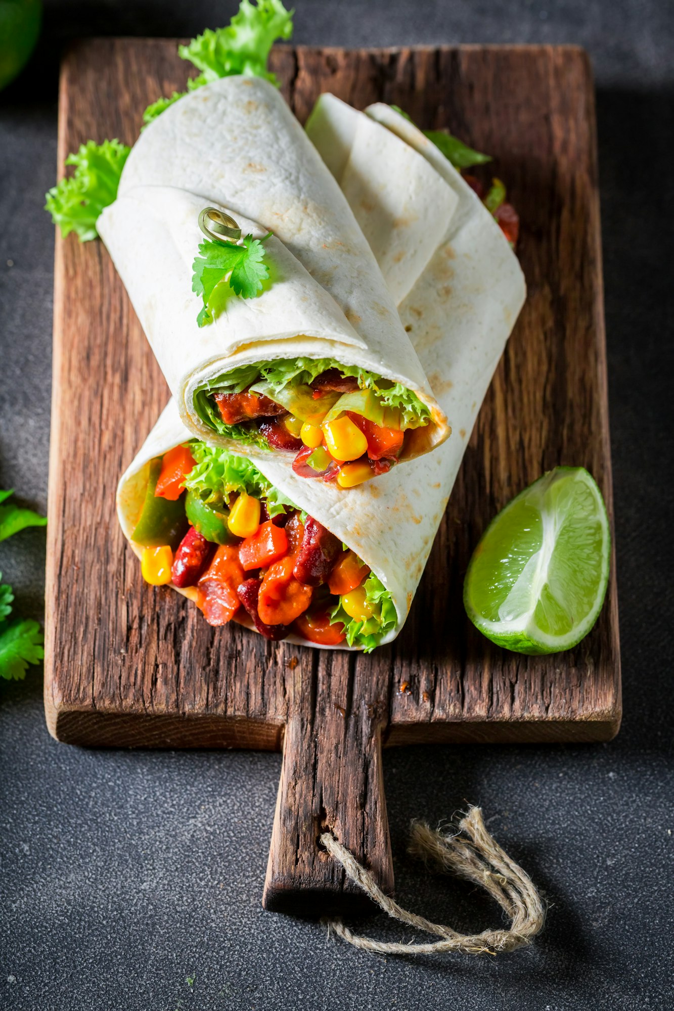 Top view of tasty burrito made of lettuce and vegetables